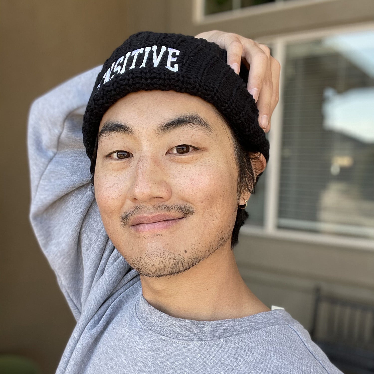 David Yi in Sensitive skin type beanie by Good Light. Proclaim to the world that you’re proud of your skin type!